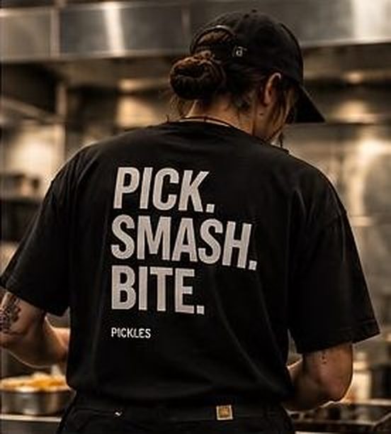 Post: PICK. SMASH. BITE. on a staff tee